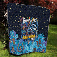 Blue quilt folded display with star grid and Bahamas Junkanoo face artwork