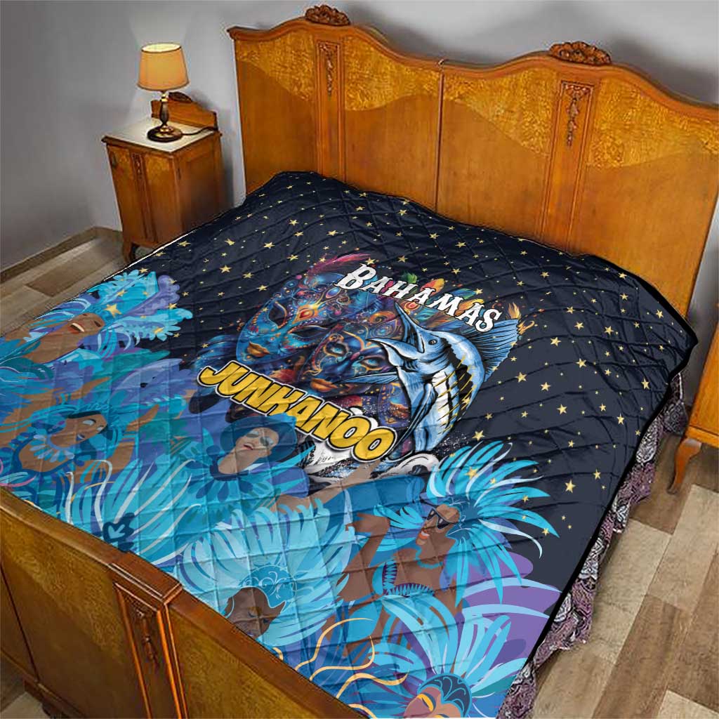 Blue quilt on bed with stars and Bahamas Junkanoo fish-mask design