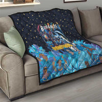 Blue quilt on couch, stars and colorful Bahamas Junkanoo mask with dancers
