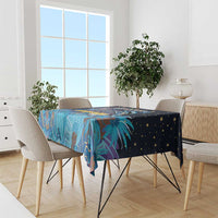 Blue tablecloth with tropical Junkanoo artwork and starry pattern