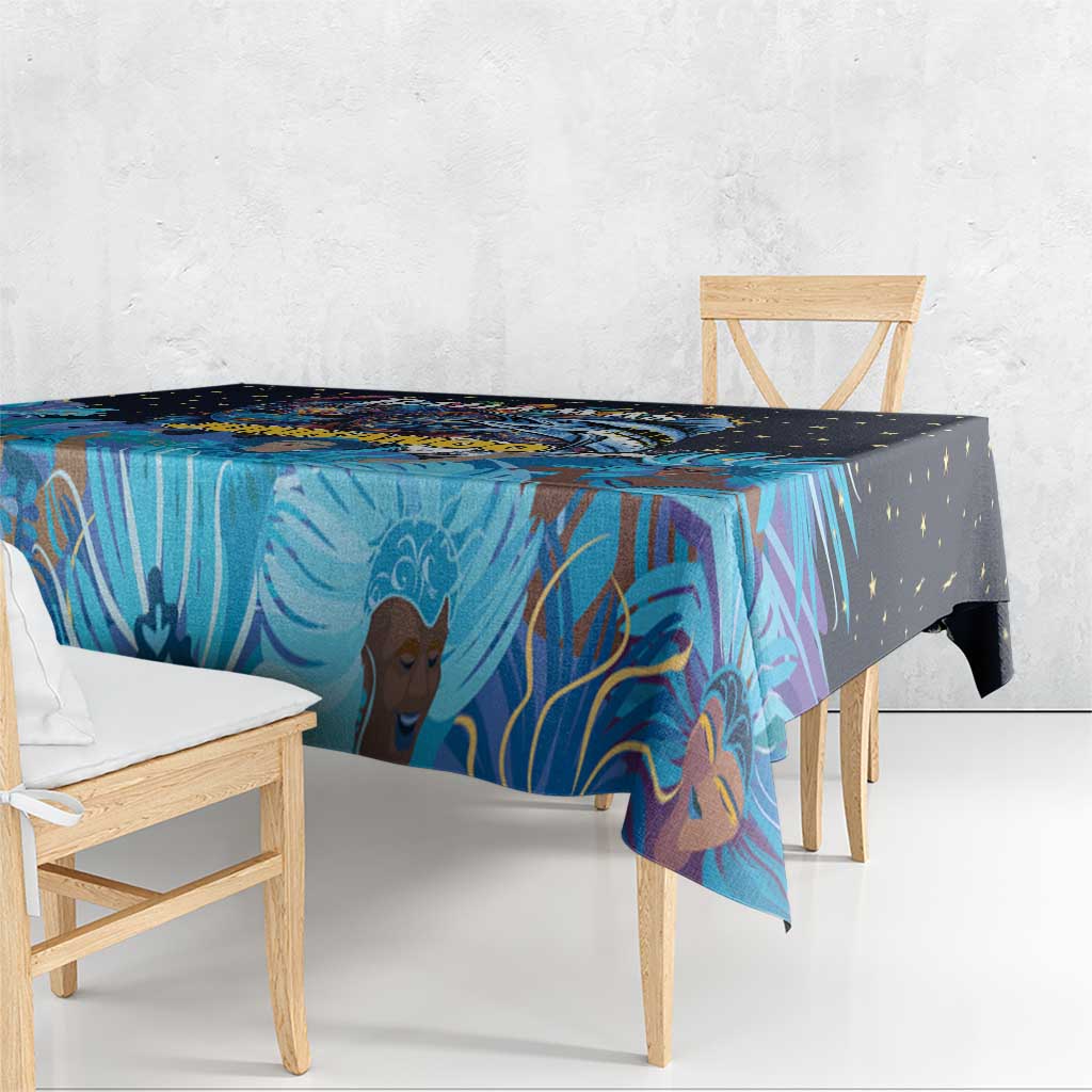 Blue tablecloth corner drape with Junkanoo mask and colorful palm design