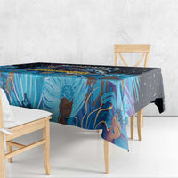 Blue tablecloth corner drape with Junkanoo mask and colorful palm design