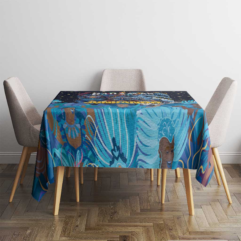 Square blue tablecloth with Junkanoo mask artwork and star pattern