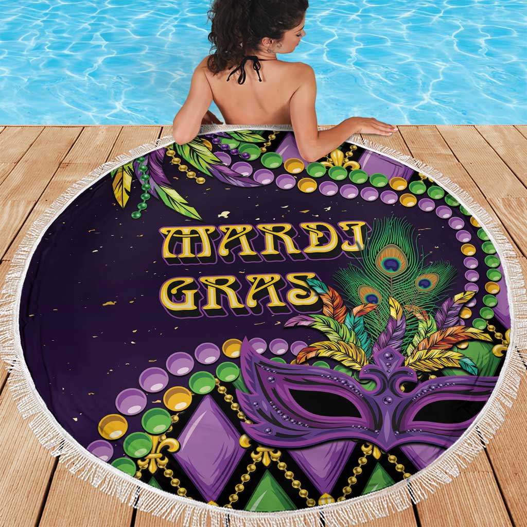 Round purple beach blanket with tassel fringe and peacock-style Mardi Gras graphic