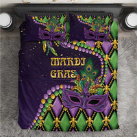 Purple Mardi Gras bedding set with purple mask, fleur-de-lis, beads and green accents