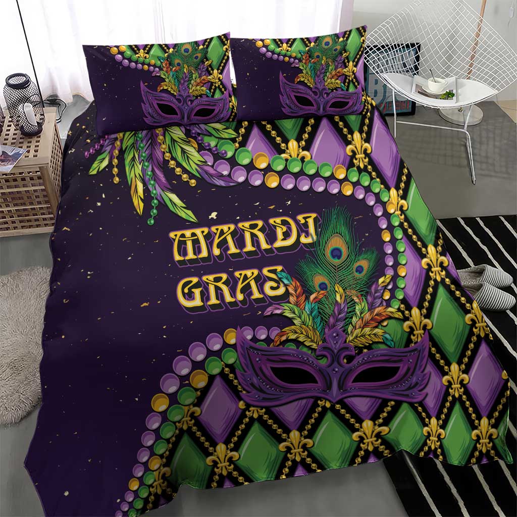 Purple Mardi Gras duvet set with two pillows featuring purple mask, fleur-de-lis and green stripes