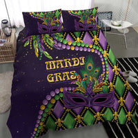 Purple Mardi Gras duvet set with two pillows featuring purple mask, fleur-de-lis and green stripes