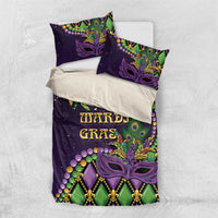 Purple Mardi Gras bedding set with two pillows and duvet, purple mask and green bead design