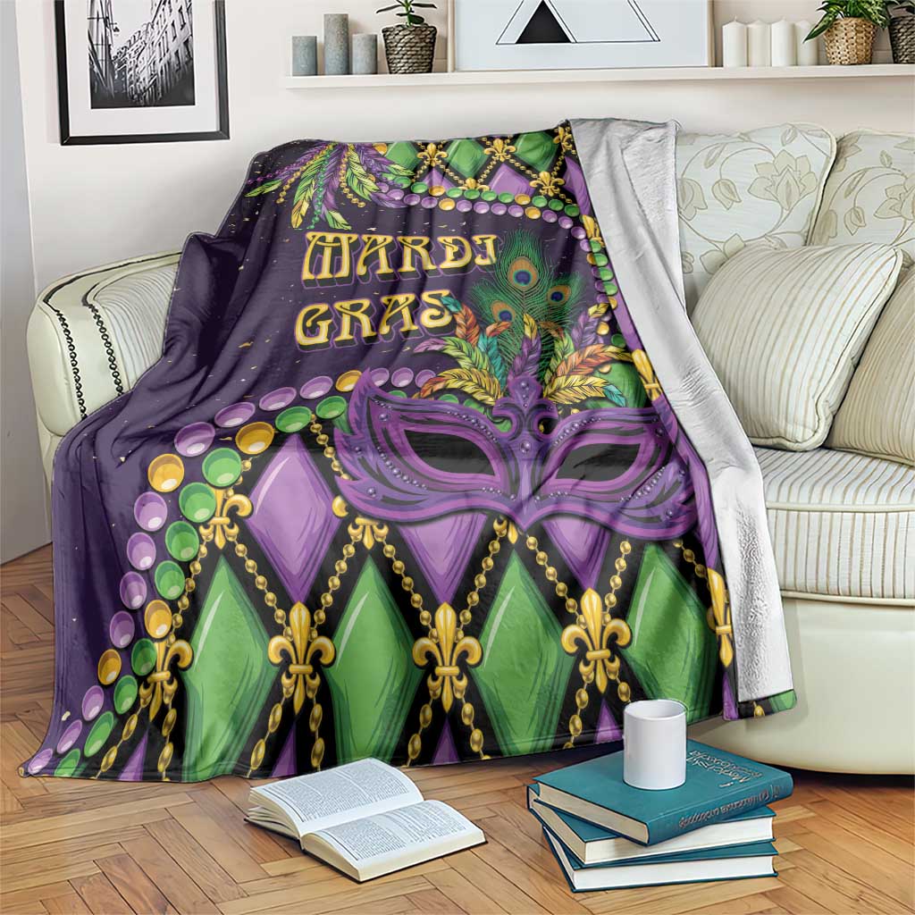 Mardi Gras decorative throw blanket with purple and green fleur-de-lis face mask pattern