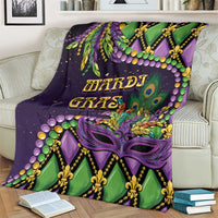 Mardi Gras throw blanket on an armchair, purple and green fleur-de-lis mask artwork