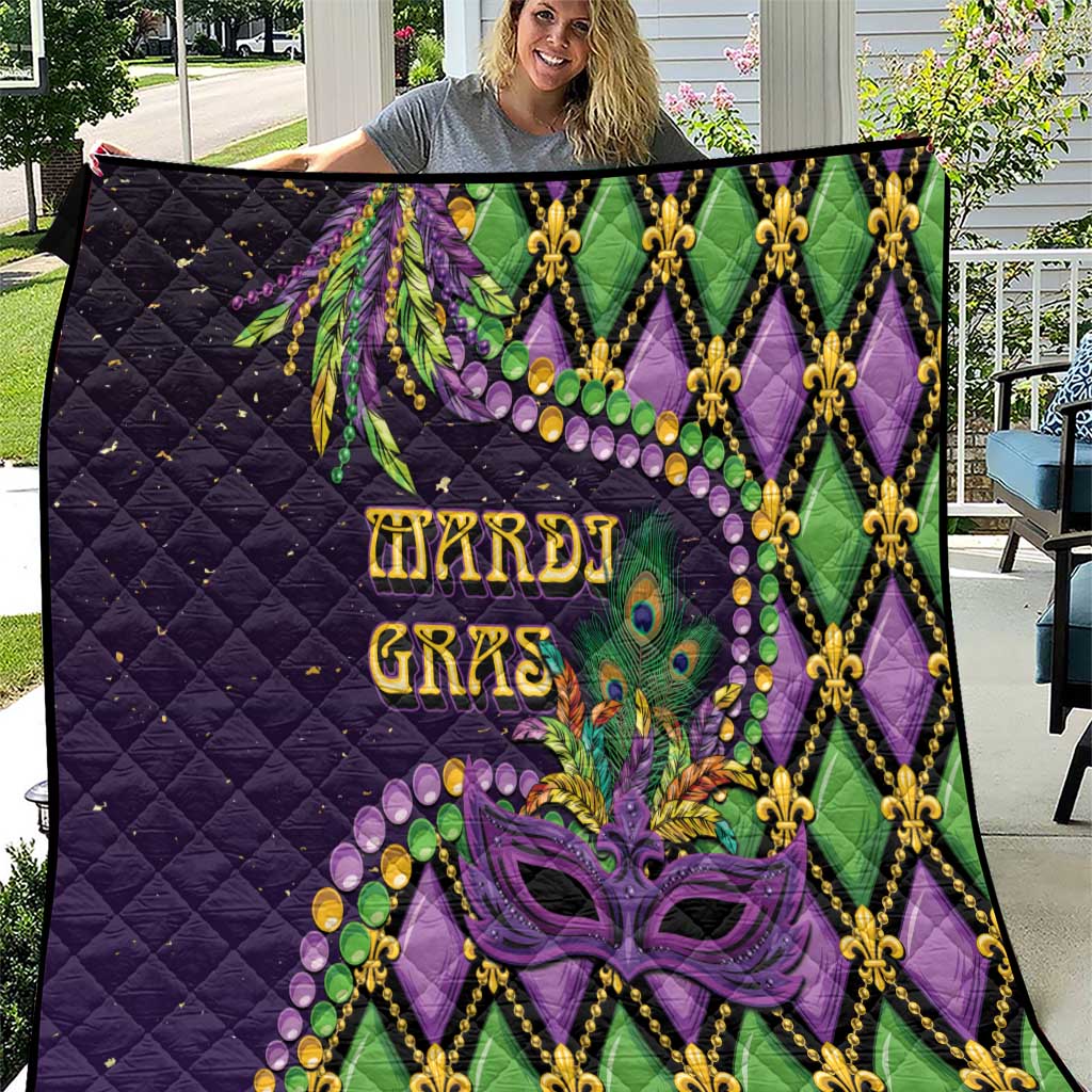 Purple Mardi Gras quilt with diamond stitching, fleur-de-lis trim, and purple mask graphic