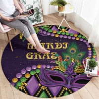 Purple round Mardi Gras carpet with fleur-de-lis mask graphic, beads and “MARDI GRAS” text