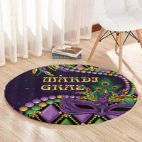 Purple round Mardi Gras carpet showing fleur-de-lis mask, beads and “MARDI GRAS” lettering