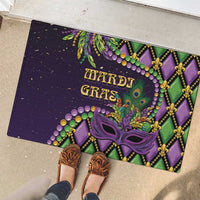 Purple Mardi Gras rubber doormat with decorative peacock-mask art and bead accents