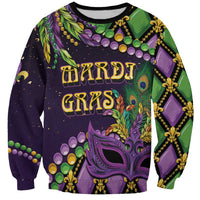 Unisex purple Mardi Gras sweatshirt with green/gold fleur-de-lis mask graphic