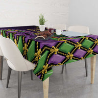 Mardi Gras tablecloth corner view with purple and green fleur-de-lis mask pattern