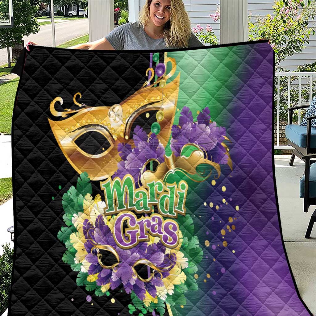 Quilt with black, green, and purple Mardi Gras feather and mask graphic