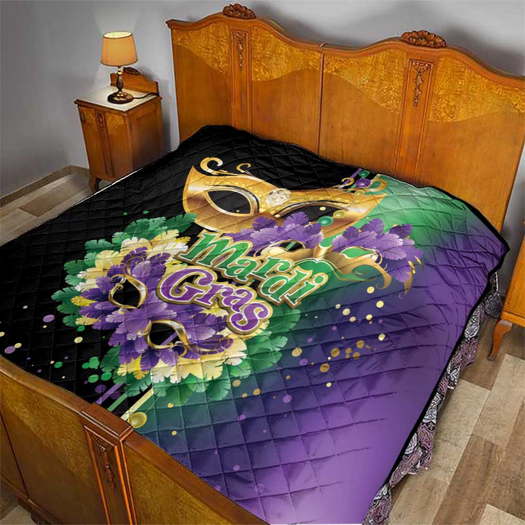 Quilt on bed, black top with Mardi Gras purple panel and gold feather mask art