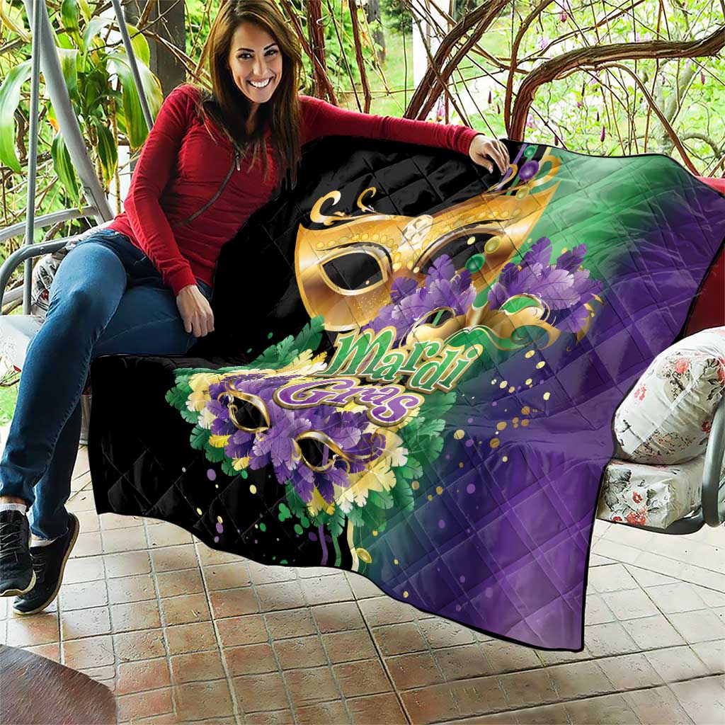 Large Mardi Gras quilt spread on patio, black base with purple and green accents