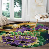 Round Mardi Gras carnival carpet showing Mardi Gras text with purple flowers and feathers