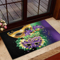 Mardi Gras doormat with gold carnival masks and purple floral design, shown on entryway