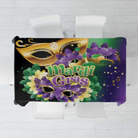 Carnival tablecloth with Mardi Gras mask, purple feathers, and gold lettering