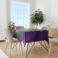 Purple Mardi Gras tablecloth with colorful mask and speckled confetti pattern
