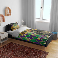 Mardi Gras bedding set with gold mask center panel, green-purple diamond pattern on black fabric.