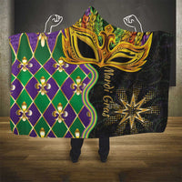 Hooded blanket with gold mask artwork, purple green diamond pattern, full hood and sherpa lining