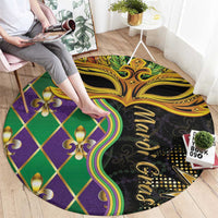 Round decorative carpet with colorful green and purple check pattern plus gold mask