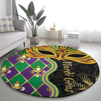 Round decorative carpet with green and purple diamond pattern and gold mask artwork