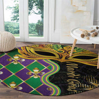 Round decorative carpet with colorful diamond grid, gold details, and fleur-de-lis accents
