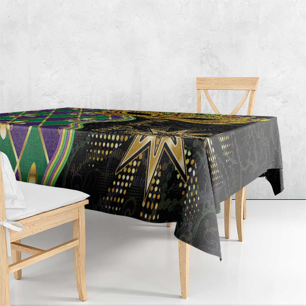 Mardi Gras tablecloth with black background, green and purple diamond panels, overhanging edge