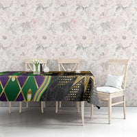 Mardi Gras tablecloth across dining table, black with purple-green diamonds and gold accents