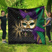 Mardi Gras quilt spread out, featuring a gold mask with gems on purple and green