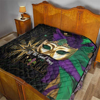 Mardi Gras quilt on bed, gold mask graphic with purple and green panels over black