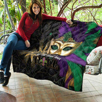 Mardi Gras quilt held up, gold masquerade mask over purple and green diamond quilting