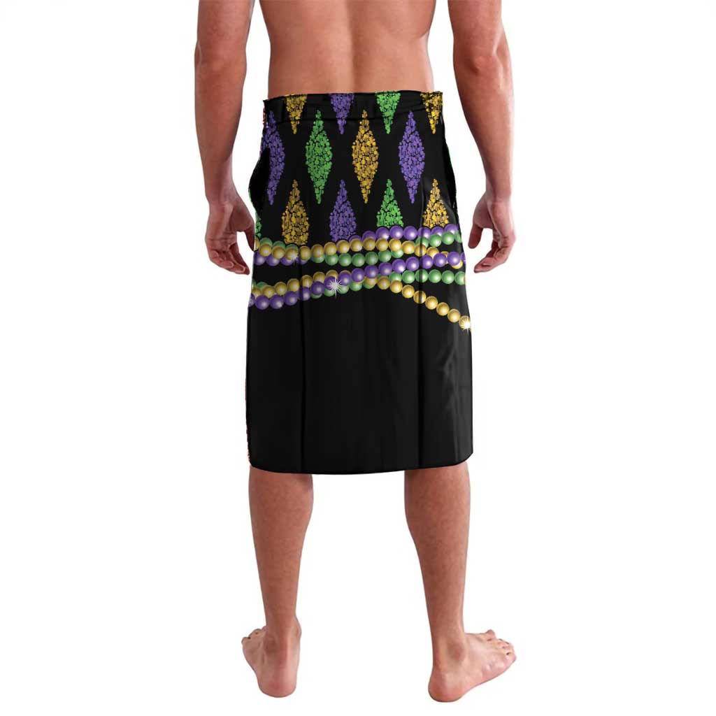 Black Mardi Gras swim shorts with green, purple, and gold pennant pattern and bead trim
