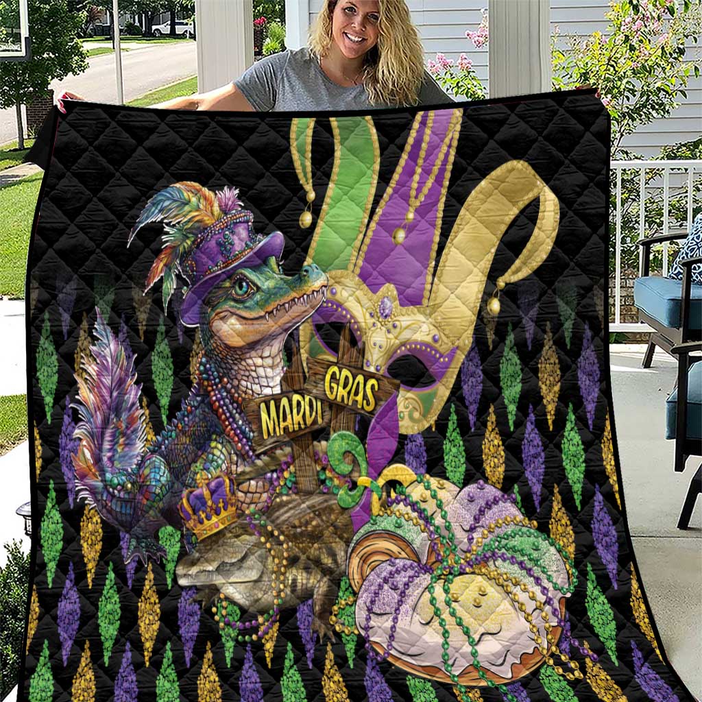 Black quilt with glittery alligator art and fleur-de-lis pattern in purple, green, gold