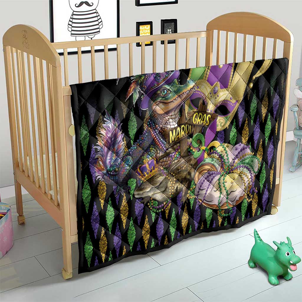 Black quilt with alligator and fleur-de-lis artwork, purple and gold Mardi Gras lettering