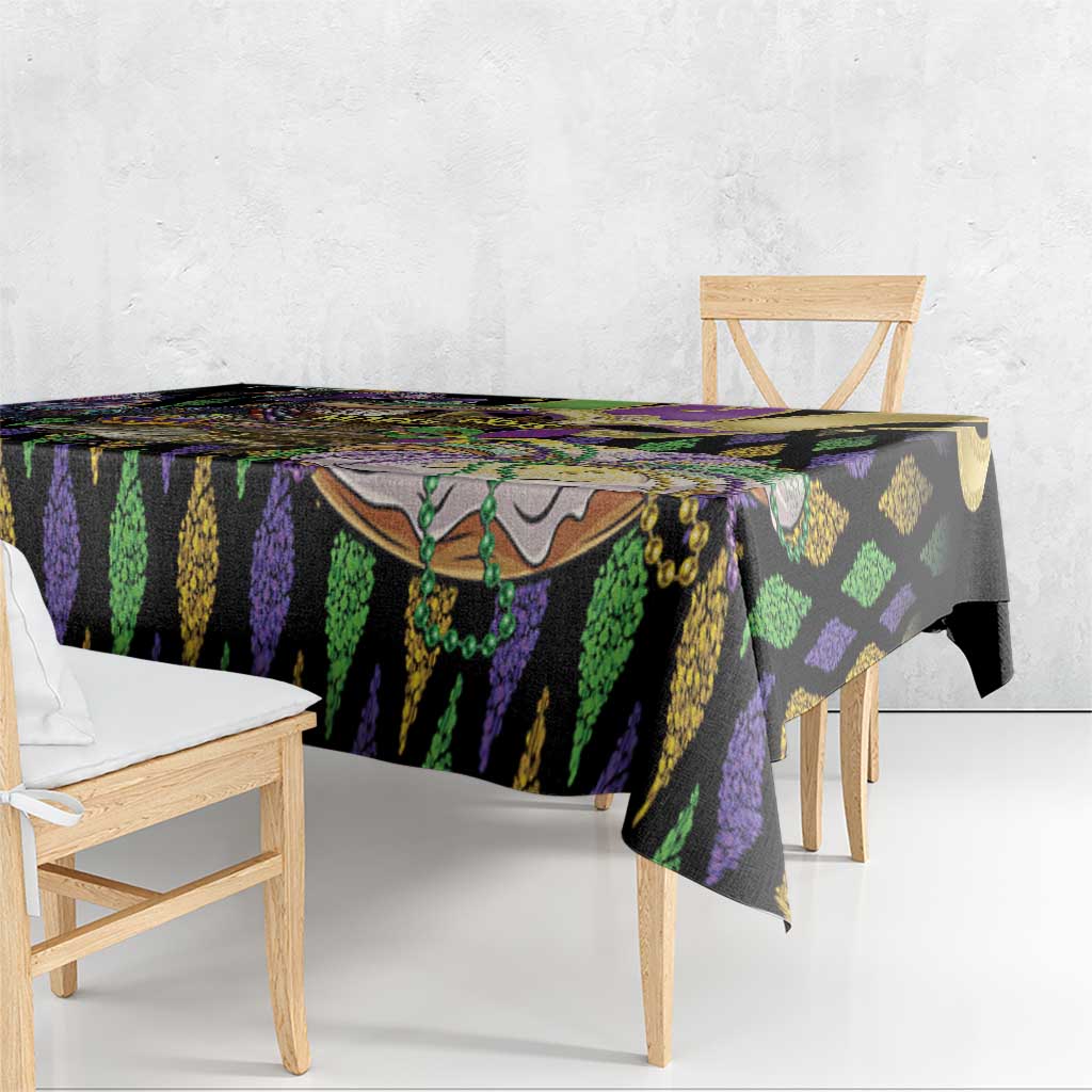 Mardi Gras tablecloth over dining table, black purple green vertical stripe design