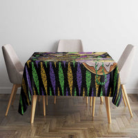Mardi Gras tablecloth on table, black purple green vertical stripe pattern