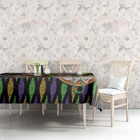 Mardi Gras tablecloth on dining table, black purple green vertical stripe pattern