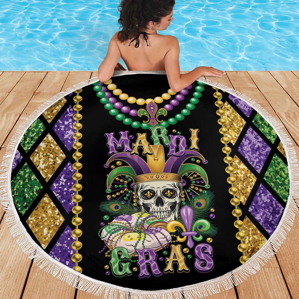 Round Mardi Gras beach blanket with skull in fleur-de-lis crown and green-gold bead garland