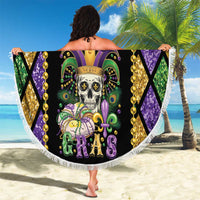 Round Mardi Gras beach blanket with skull artwork, colorful beads, and white tassel fringe edge