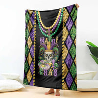 Mardi Gras skull blanket draped over couch, black center with bead necklace graphic