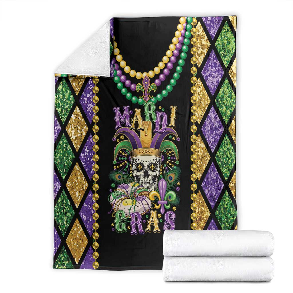 Mardi Gras skull blanket folded, black center with beads and fleur-de-lis design