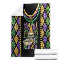 Mardi Gras skull blanket folded, black center with beads and fleur-de-lis design