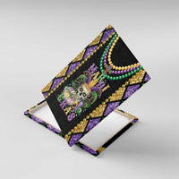 Mardi Gras skull canvas wall art angled view with purple, green, and gold bead details