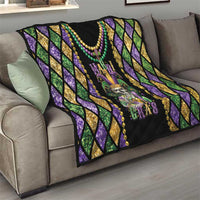 Mardi Gras quilt blanket with purple and gold diamond pattern and skull fleur de lis design